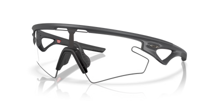 Oakley - Lunettes Sphaera Slash Lunettes Oakley Carbon W/Clear-Black Photochromic 